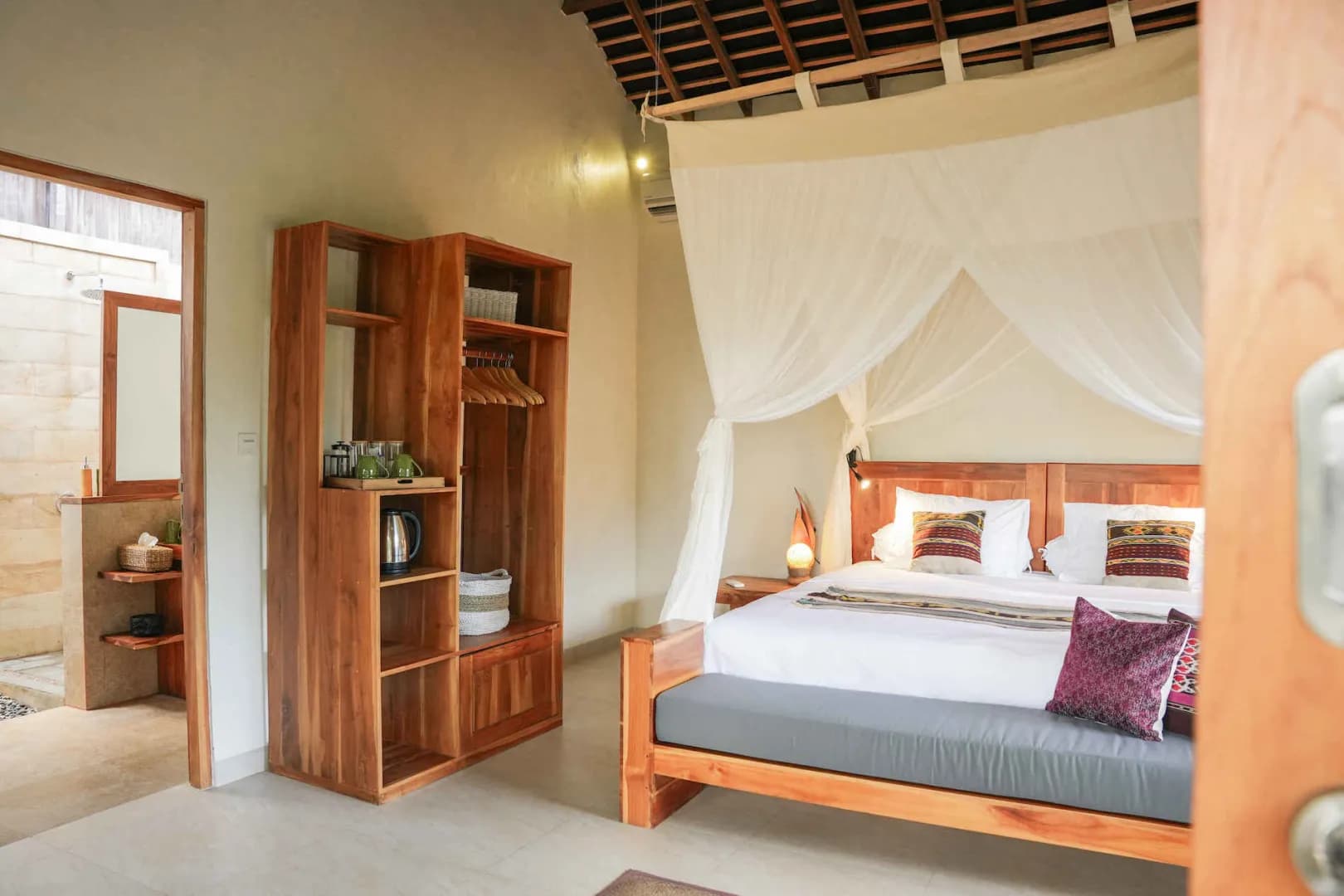 A tastefully decorated Hillside Bungalow with a large bed at Alor Tanapi Dive Resort. A tastefully decorated Hillside Bungalow with a large bed at Alor Tanapi Dive Resort.