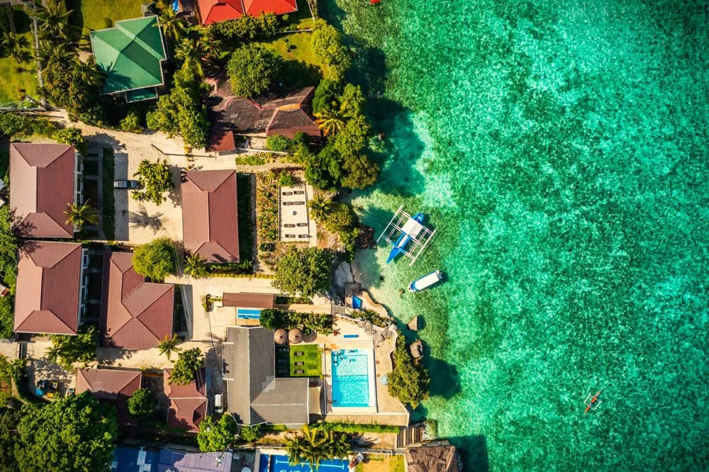 Cebu Seaview Dive Resort ariel view of ocean , pool, and resorts rooms Cebu Seaview Dive Resort ariel view of ocean , pool, and resorts rooms