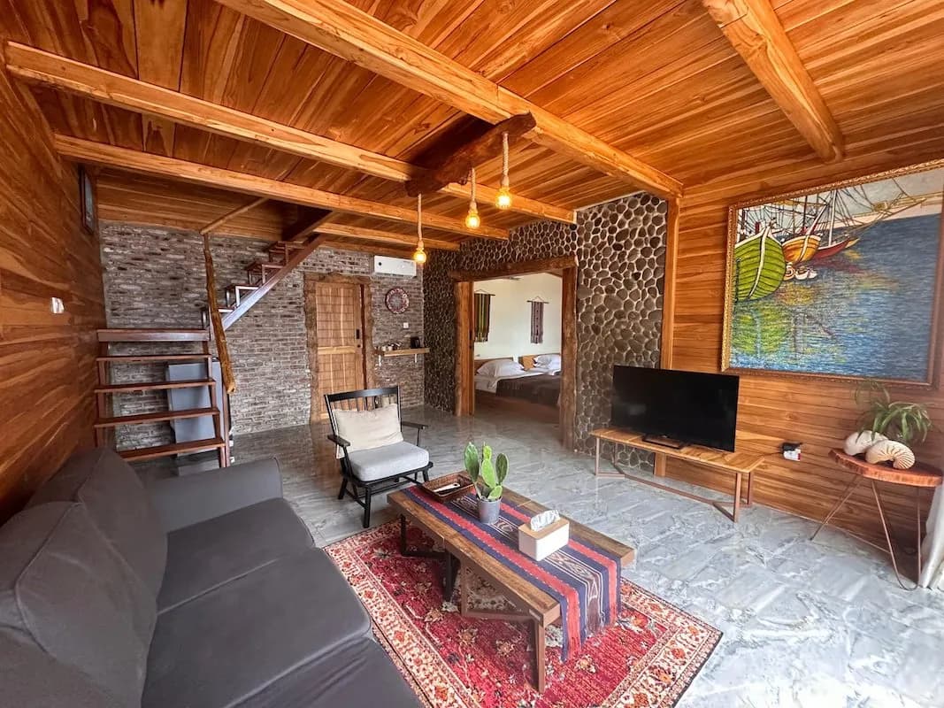 Downstairs living area with a couch and TV Downstairs living area with a couch and TV